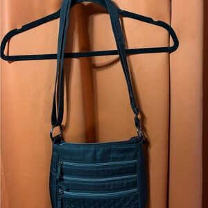 Compact Black Lug Crossbody Bag with Multiple Zip Pockets